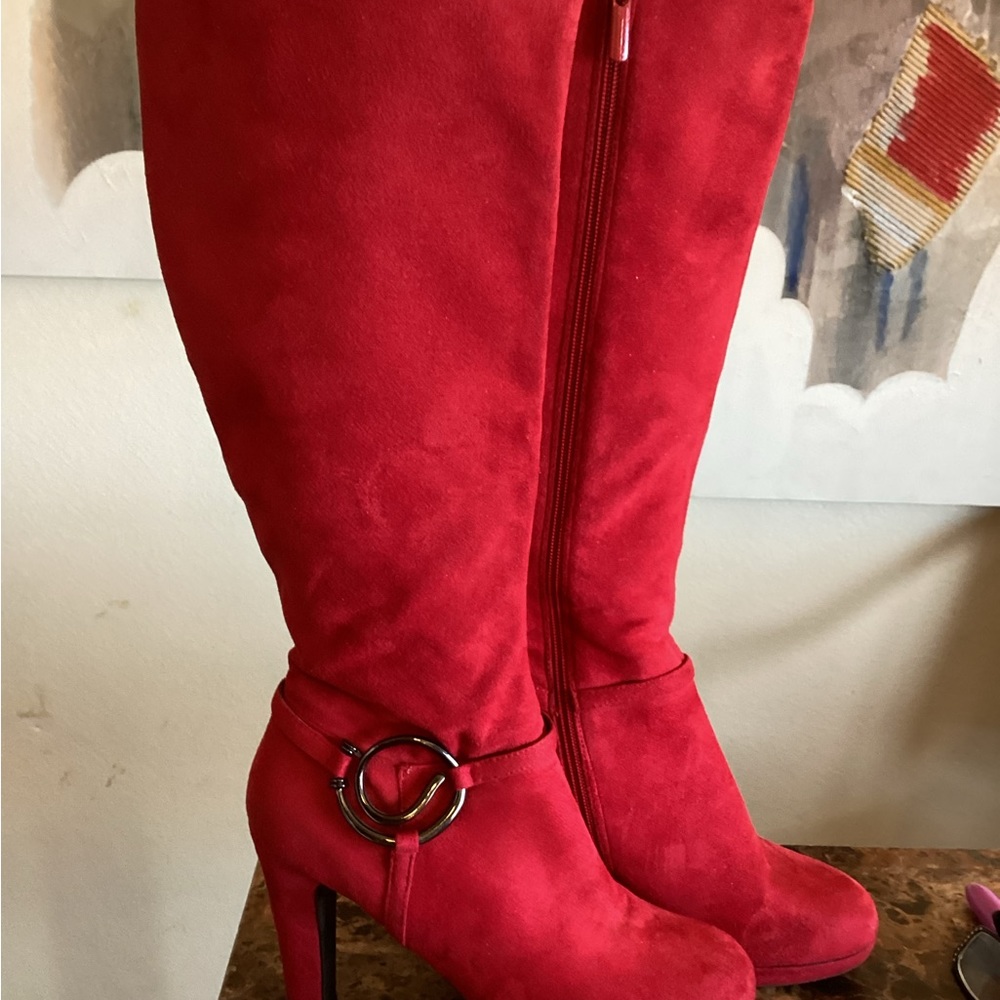 Red Swede Knee Boots. With black metal design medallion